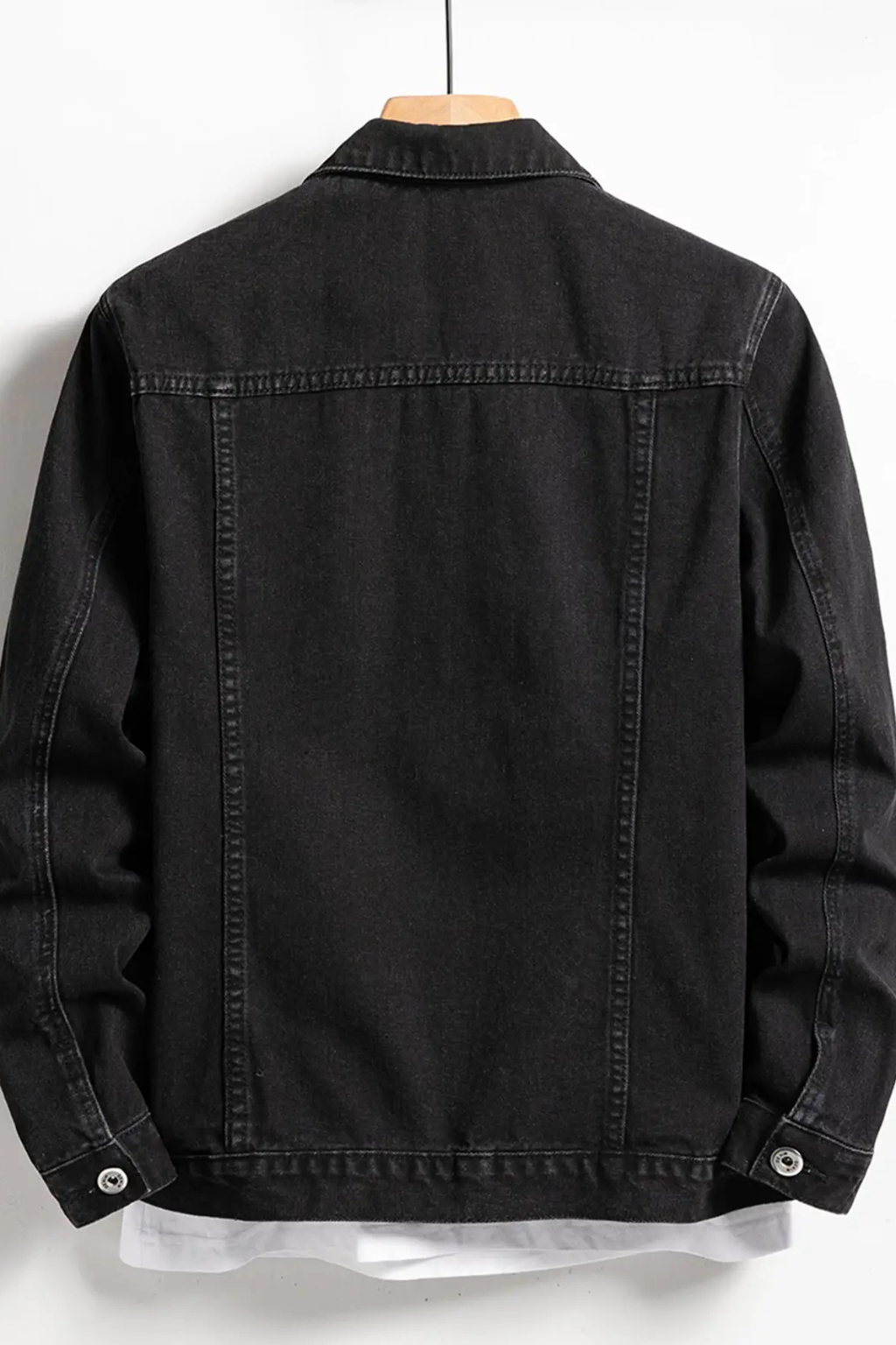 Men's black button-front denim jacket with chest flap pockets