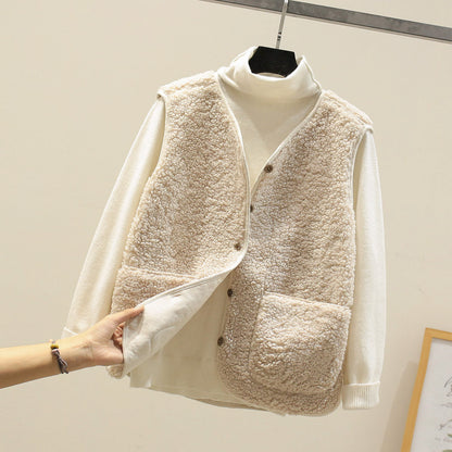 Women's textured sleeveless vest with button front and large patch pockets