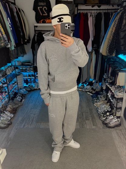 Gray pullover hoodie with hood, long sleeves and front kangaroo pocket