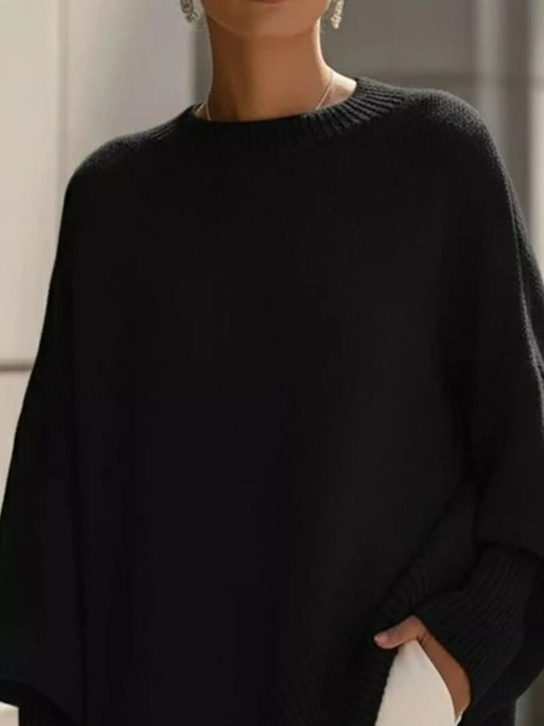Women's oversized sweater with wide sleeves and ribbed cuffs