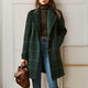 Women's long checked coat with notched lapels and button front