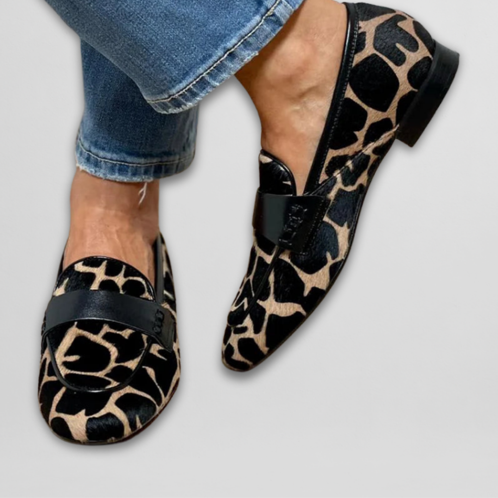 Women's animal print loafers with black trim