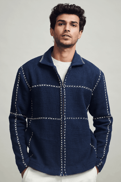 Men's navy zip jacket with stand collar and contrasting cross-stitch detailing