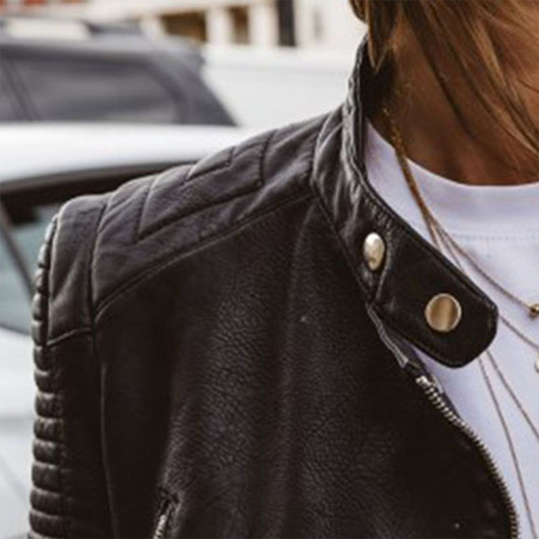 Women's black quilted biker jacket with zip front and long sleeves