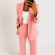 Women's tailored two-piece suit with blazer and straight trousers