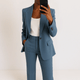 Women's tailored two-piece suit with blazer and straight trousers