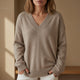 Women's beige V-neck sweater with long sleeves and ribbed trim