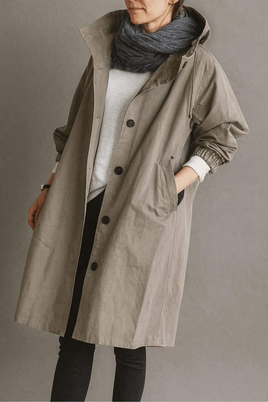 Women's hooded button-front trench coat with pockets