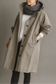 Women's hooded button-front trench coat with pockets