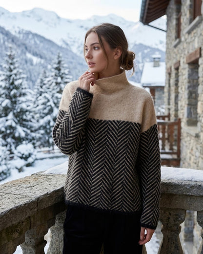 Women's long-sleeve turtleneck sweater with contrasting chevron pattern