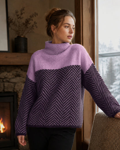 Women's long-sleeve turtleneck sweater with contrasting chevron pattern