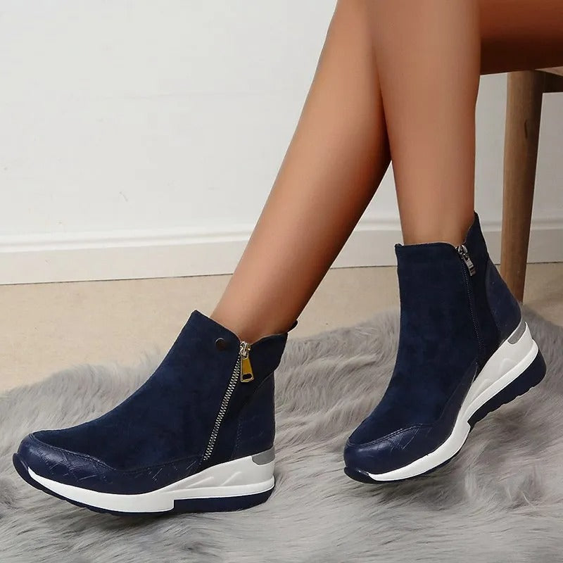 Women's ankle boots with side zippers, textured panels and wedge platform soles
