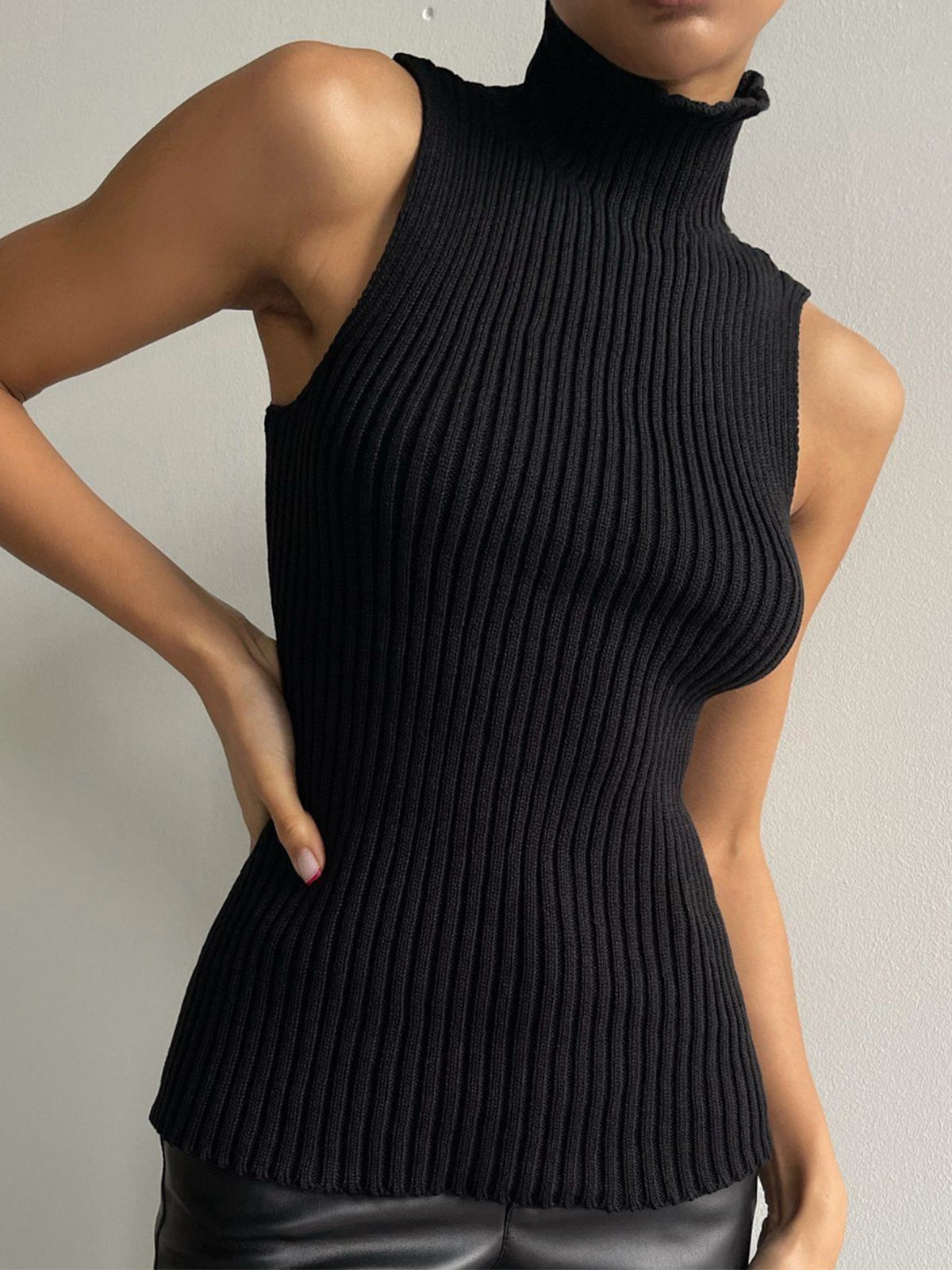 Women's ribbed sleeveless knit top with mock neckline and fitted shape