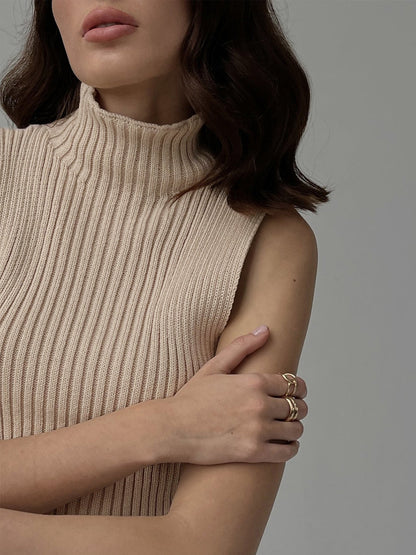 Women's ribbed sleeveless knit top with mock neckline and fitted shape