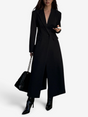 Women's long black single-breasted coat with notched lapels and front pockets