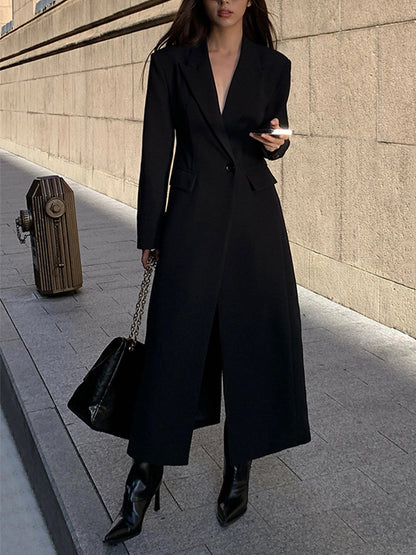 Women's long black single-breasted coat with notched lapels and front pockets