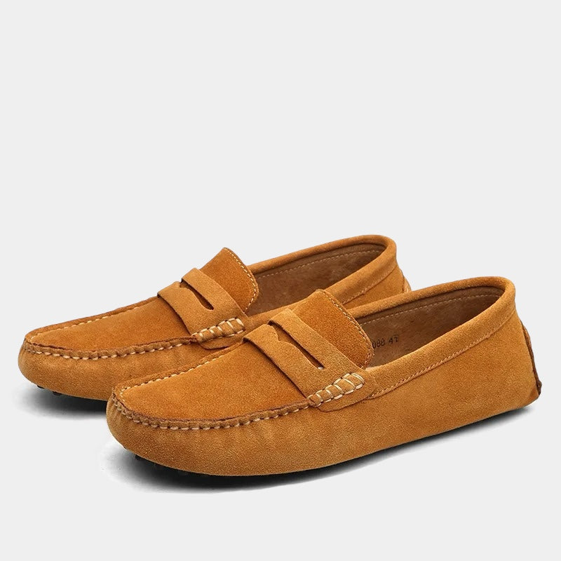 Pair of men's slip-on loafers with moc toe stitching and penny strap detail