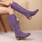 Women's knee-high western boots with embroidered detailing and block heels