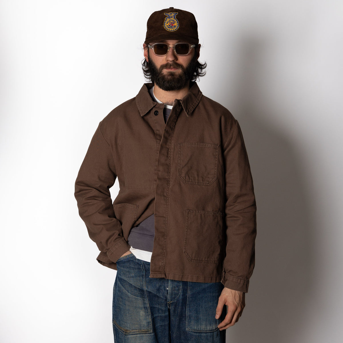 Men's brown utility jacket with shirt collar, long sleeves and four patch pockets