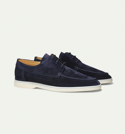 Men's lace-up moc toe loafers shown in navy blue and beige with light soles