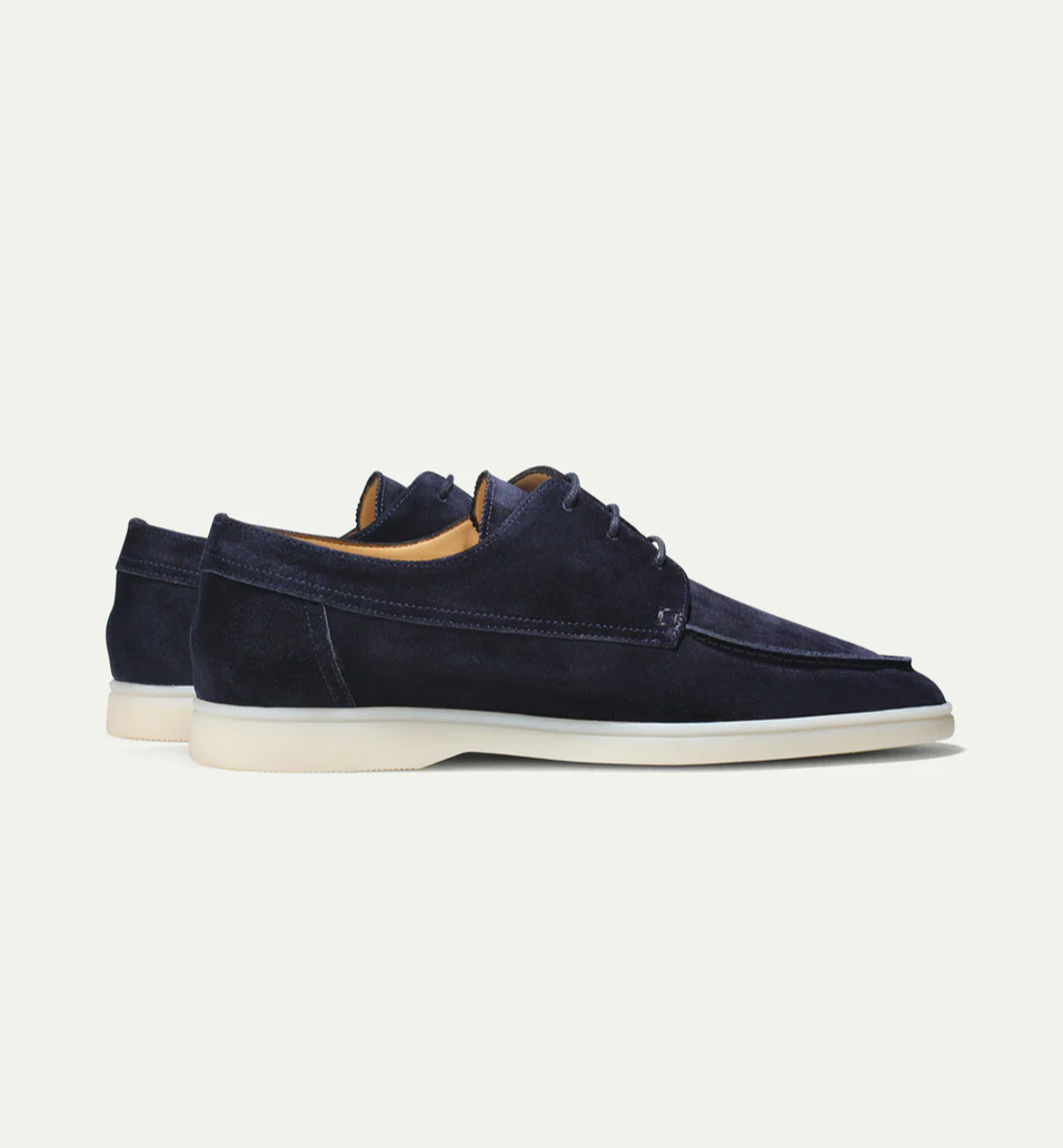 Men's lace-up moc toe loafers shown in navy blue and beige with light soles