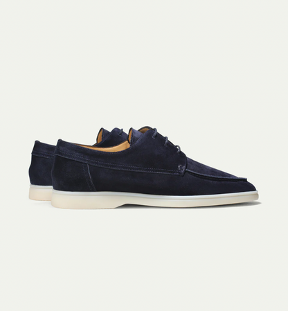 Men's lace-up moc toe loafers shown in navy blue and beige with light soles