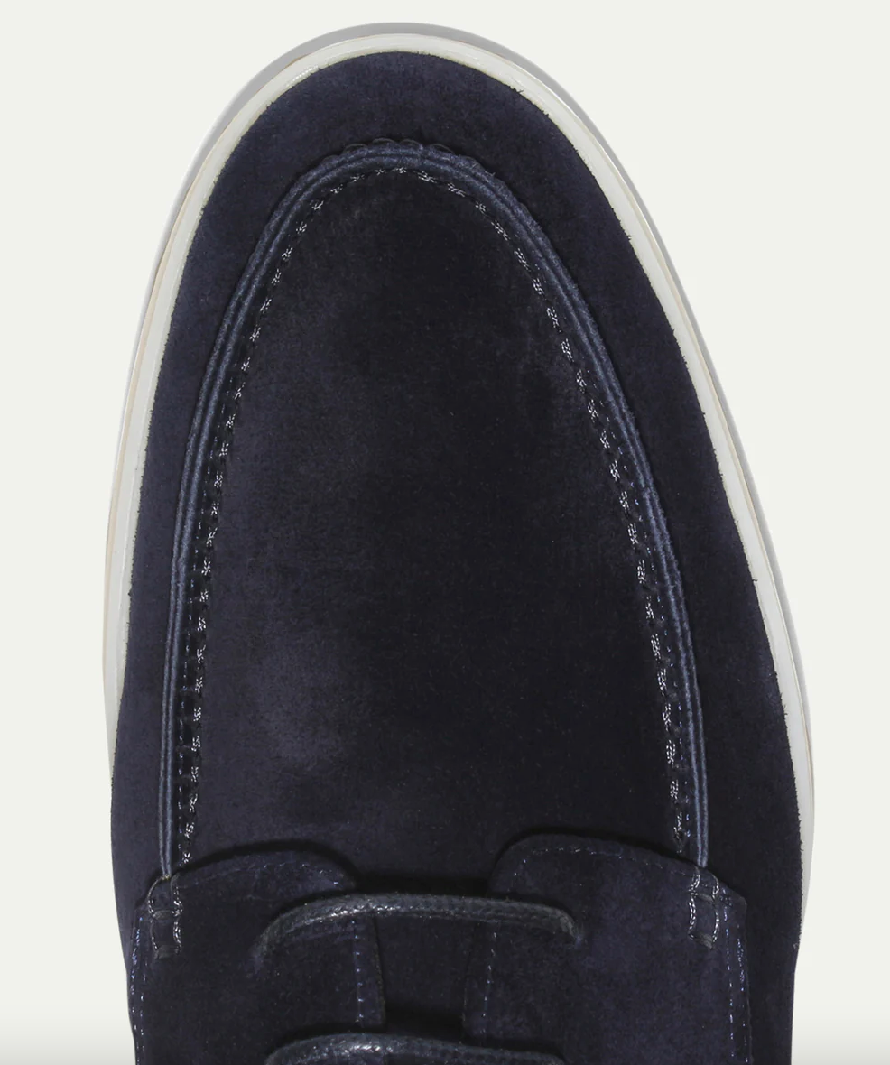 Men's lace-up moc toe loafers shown in navy blue and beige with light soles