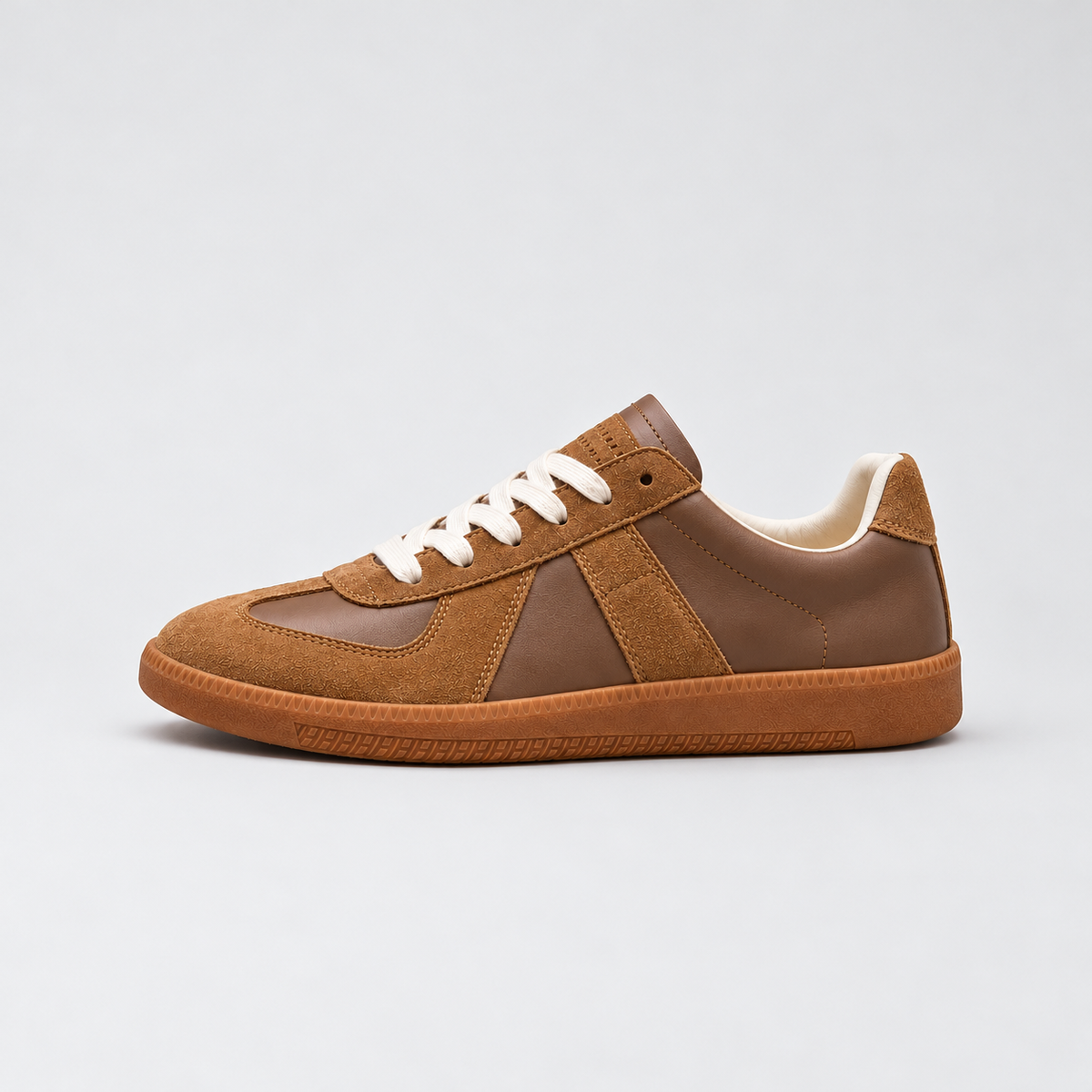 Men's low-top lace-up sneakers with textured panels and flat sole