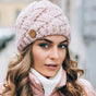 Women's chunky cable knit beanie hat with folded edge and front patch