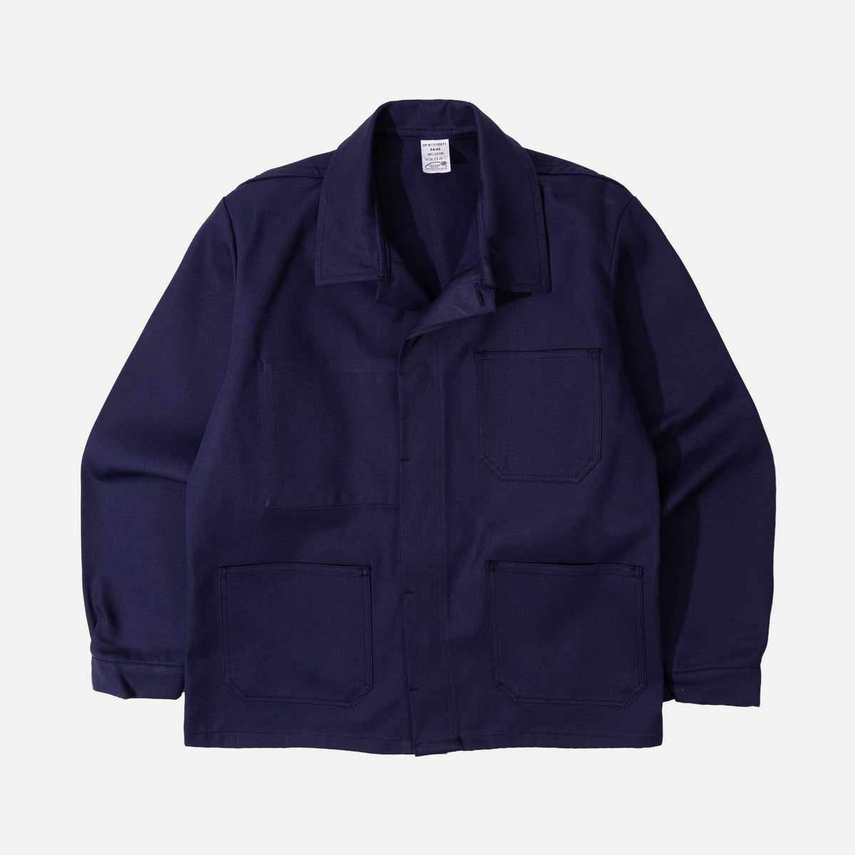 Men's navy chore jacket with button front, pointed collar and four patch pockets