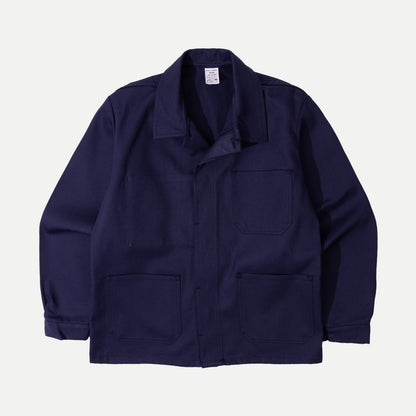 Men's navy chore jacket with button front, pointed collar and four patch pockets