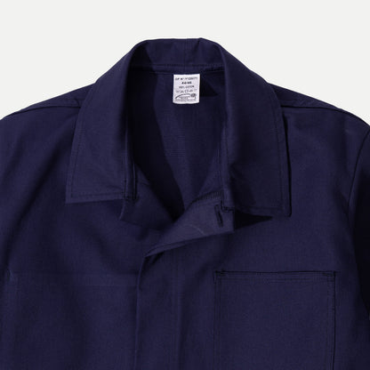Men's navy chore jacket with button front, pointed collar and four patch pockets