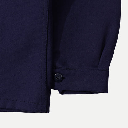 Men's navy chore jacket with button front, pointed collar and four patch pockets