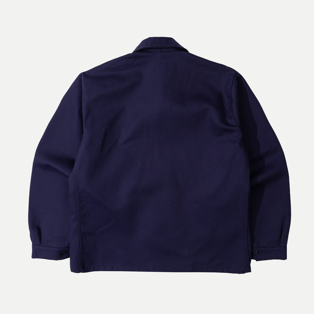 Men's navy chore jacket with button front, pointed collar and four patch pockets