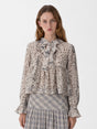 Women's beige animal print blouse with tie neckline and long sleeves