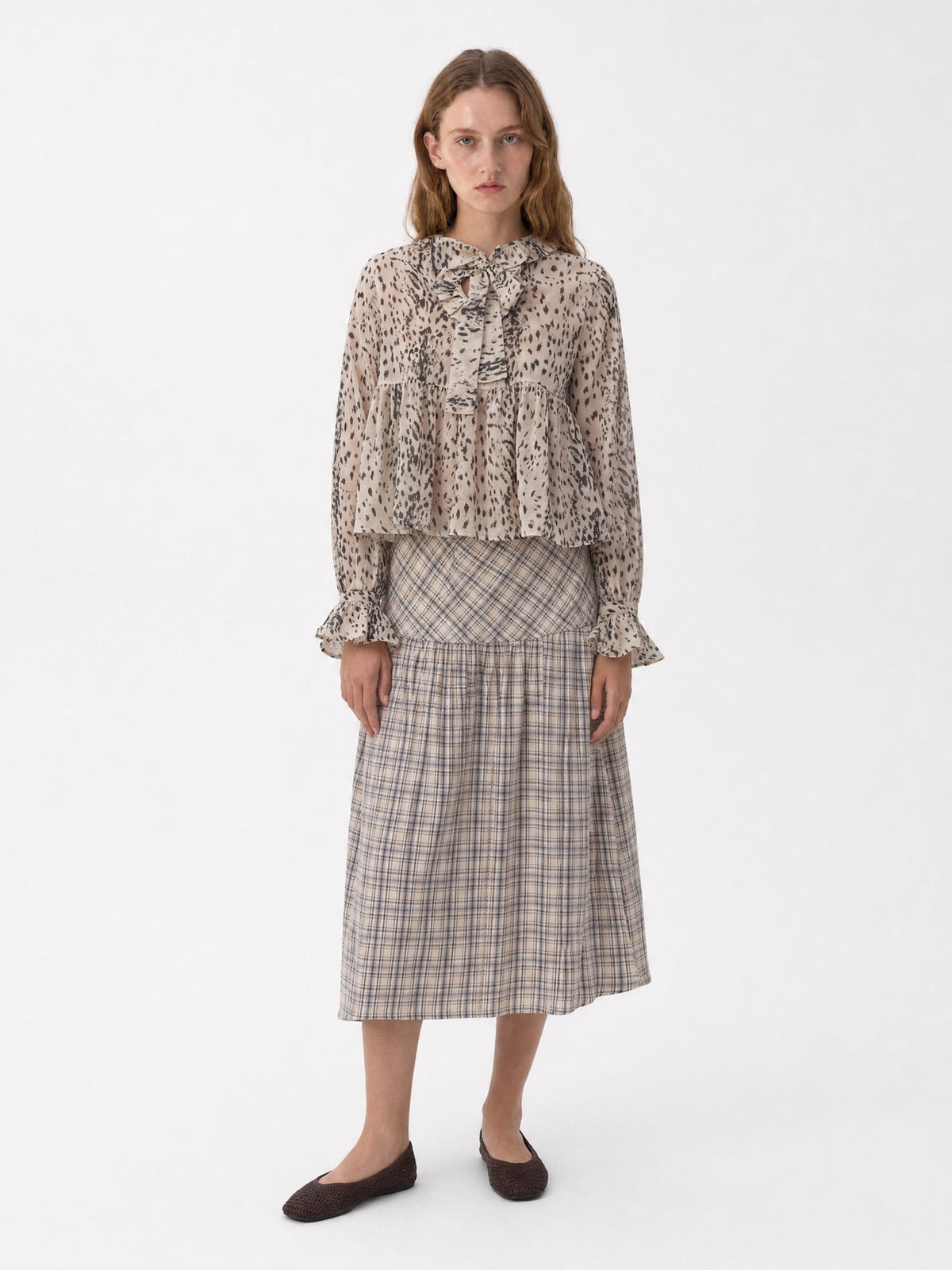 Women's beige animal print blouse with tie neckline and long sleeves