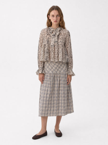 Women's beige animal print blouse with tie neckline and long sleeves