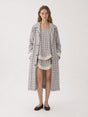 Women's long checked trench coat with point collar and button front
