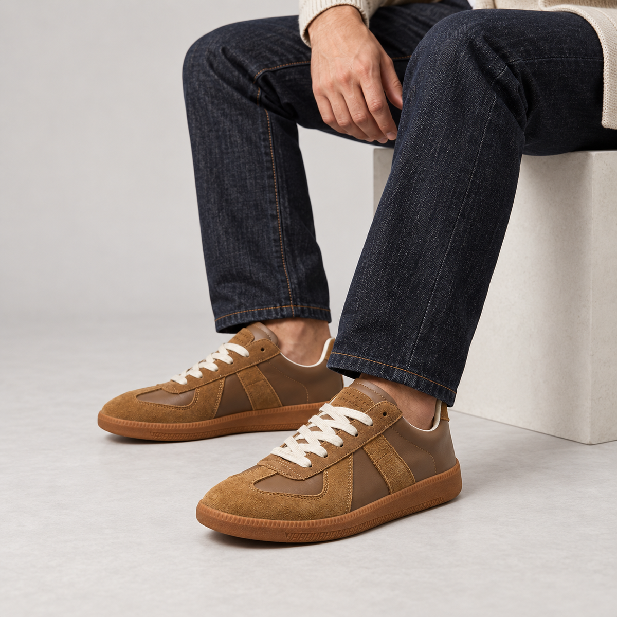 Men's low-top lace-up sneakers with textured panels and flat sole