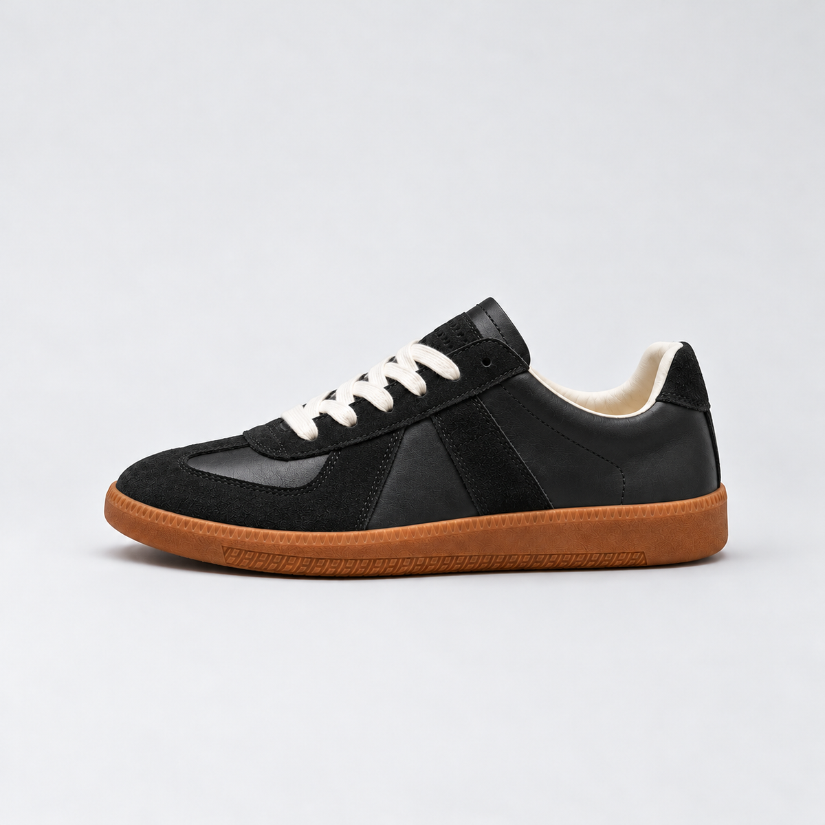 Men's low-top lace-up sneakers with textured panels and flat sole