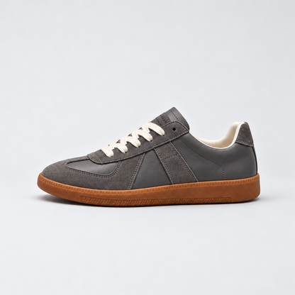 Men's low-top lace-up sneakers with textured panels and flat sole