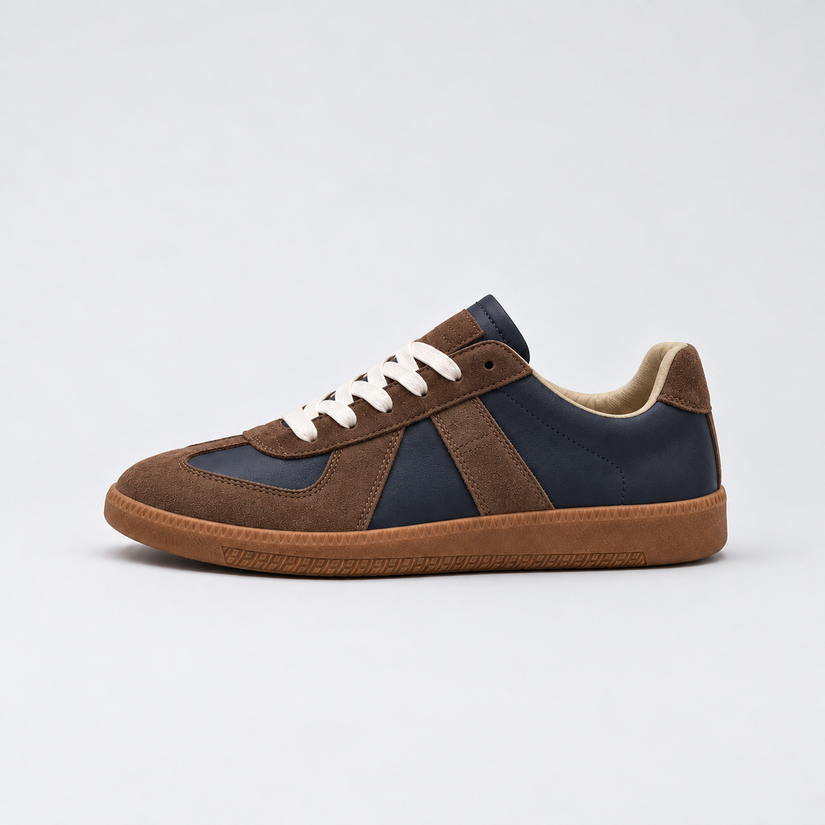 Men's low-top lace-up sneakers with textured panels and flat sole