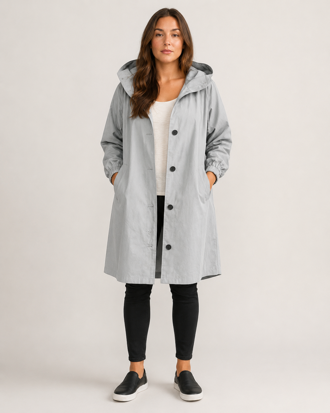 Women's hooded mid-thigh rain coat with button front and long sleeves