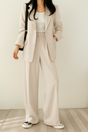Women's tailored two-piece blazer suit with wide-leg trousers