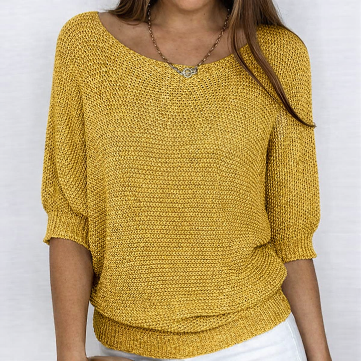 Women's ribbed knit sweater with wide neckline and three-quarter sleeves