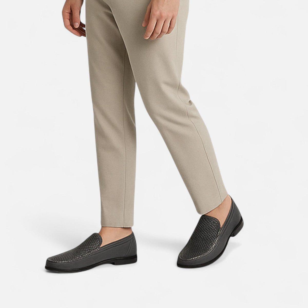 Men's perforated slip-on loafer with stitched trim and flat sole