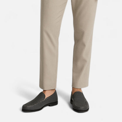 Men's perforated slip-on loafer with stitched trim and flat sole