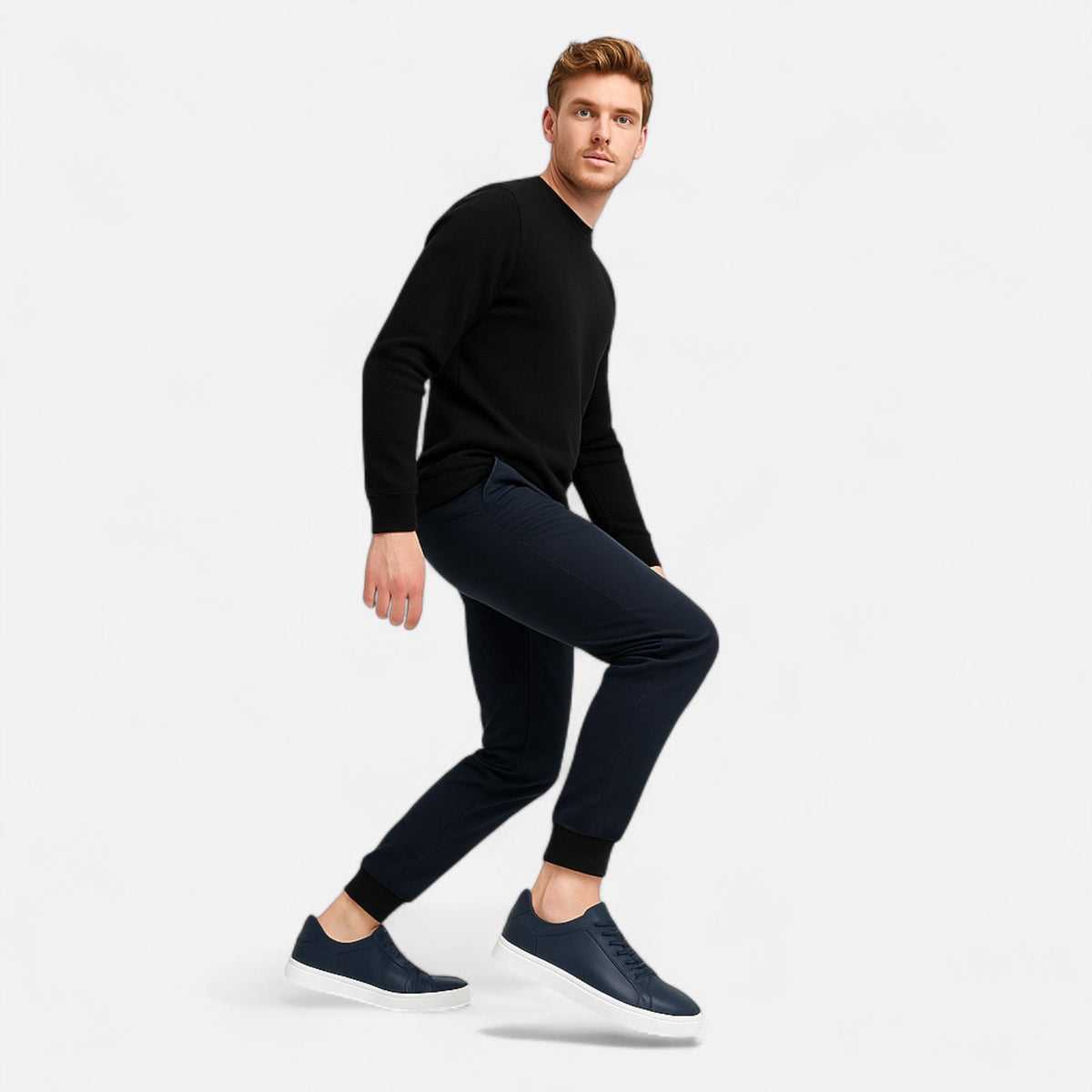Men's low-top slip-on sneakers with stitched panels and flat white soles