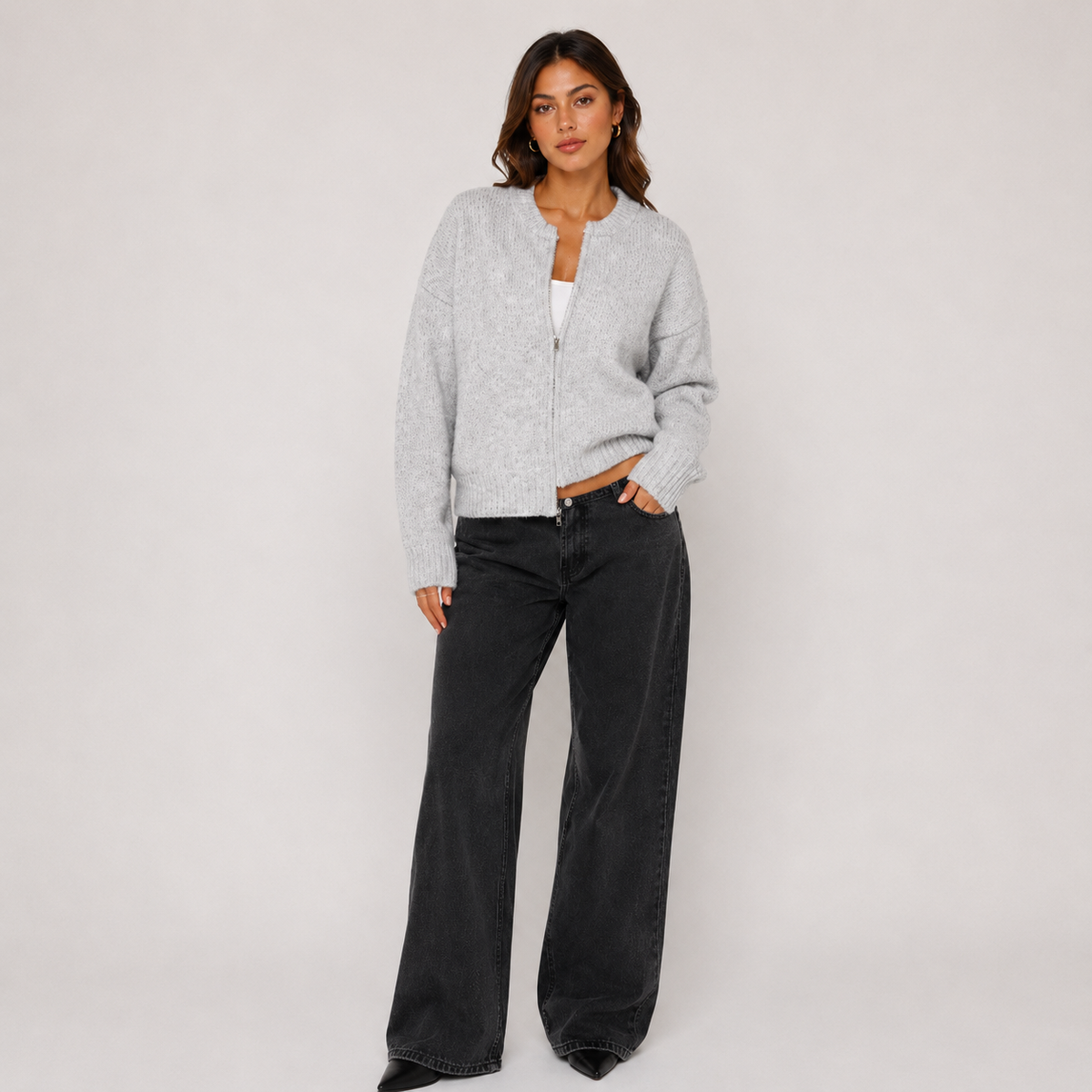 Women's grey knit jacket with round neckline, front zipper and long sleeves