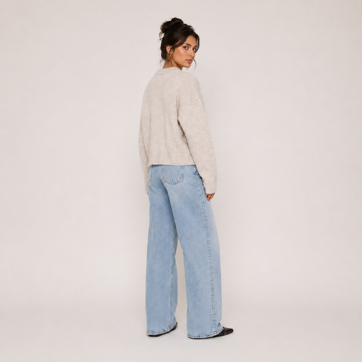 Women's beige knit jacket with crew neckline, zip front and long sleeves